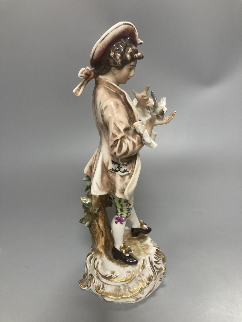 A pair of Wessel Frankenthal figures, 26cm, and a French bisque gallant, 29cm